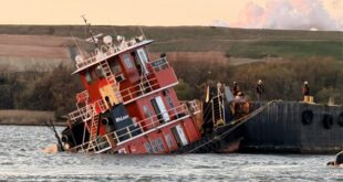 sinking towboat and brge