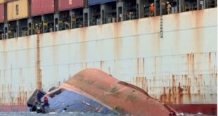 capsized tugboat